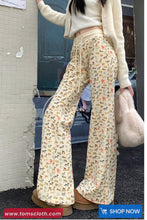 Person wearing patterned pants with a blurred background