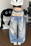 Person wearing oversized blue jeans with a patterned bandana, standing in a room.