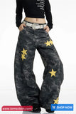 Camouflage pants with yellow stars worn by a person on a white background