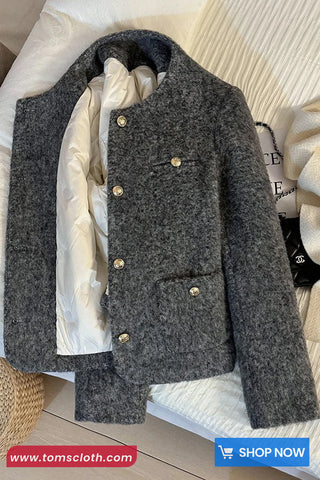 Gray textured jacket with gold buttons on a light background