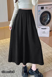 Person wearing a black skirt in a room with a washing machine.