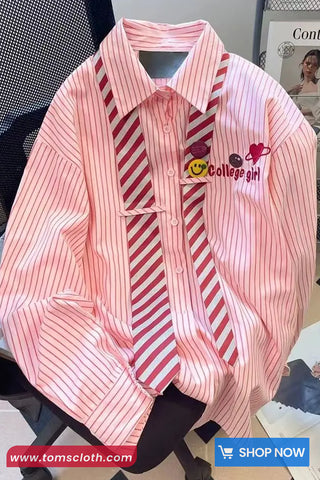 Pink and white striped shirt with 'College girl' embroidery on a chair.