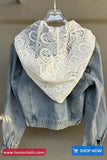 Denim jacket with a lace scarf draped over it on a hanger, brand 'TomsCloth' visible.