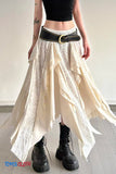 Person wearing a white lace skirt, black top, and black boots with a plain background