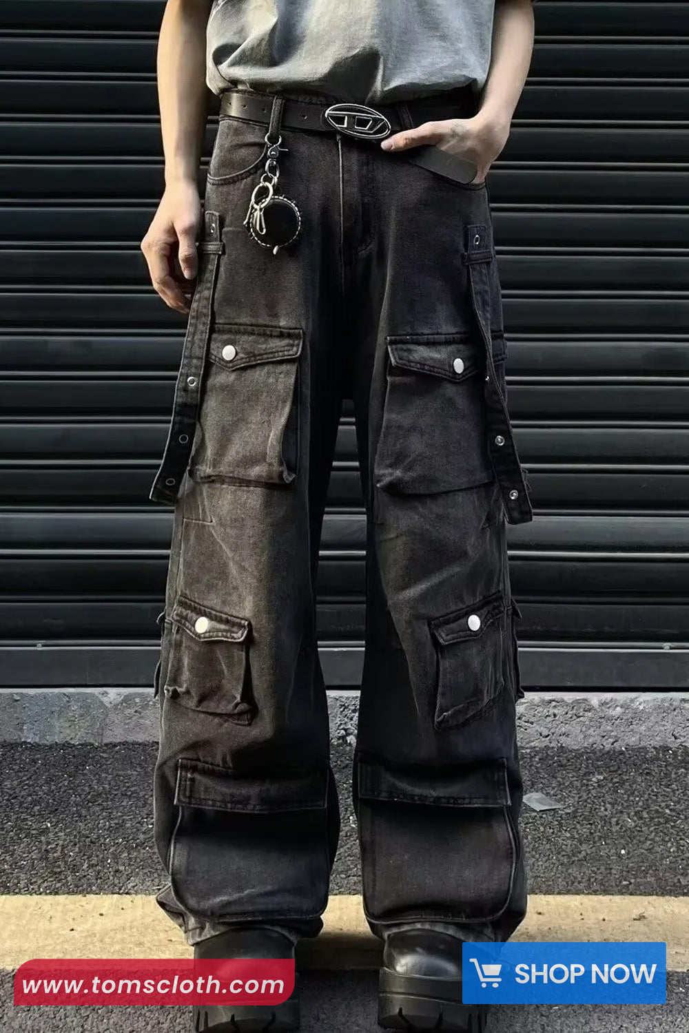 Person wearing dark cargo pants with multiple pockets against a striped background