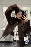 Person taking a mirror selfie wearing a brown jacket in a bathroom.