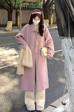 Person wearing a pink coat on a street