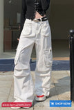 Person wearing white cargo pants with a blurred background