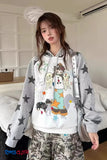 Person wearing a gray hoodie with colorful dog illustrations in a room.