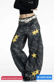 Camouflage pants with yellow stars and a black top on a white background