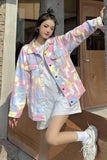 Person wearing a colorful jacket standing in front of a wooden door.