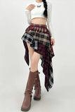 Person wearing a white top, plaid skirt, and brown boots on a white background