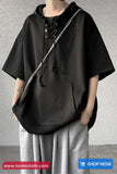 Black poncho worn by a mannequin against a gray background with 'tomscloth.com' branding.