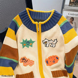 Colorful striped sweater with patches on a neutral background