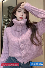 Woman wearing a pink knitted sweater with a blurred background