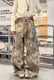Person wearing camouflage pants and a light-colored jacket in an indoor setting with IKEA visible.