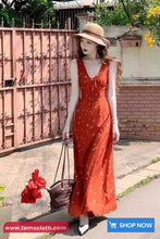 Woman in a red dress standing outdoors with a 'Shop Now' button visible.