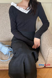 Person wearing a black outfit sitting on a couch with a blue handbag beside them, brand 'Tombcloth' visible.