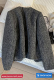 Gray textured jacket on a white surface with 'tomscloth.com' branding.