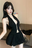Woman wearing a black dress with a blurred background