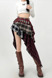 Person wearing a white top, plaid skirt, and brown boots on a white background