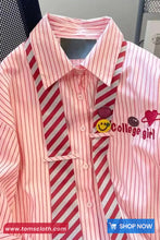 Pink and red striped shirt with 'College girl' text and graphics on a mannequin.