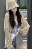 Layer your look with effortless elegance in the Long Sleeve Hollow Out Style Knitted Outer Cardigan, a stylish wardrobe essential designed for women who love lightweight knitwear with a modern feminine touch. Featuring delicate hollow out detailing, a soft knitted texture, and a versatile outerwear silhouette, this cardigan is perfect for creating chic outfits across seasons.

The standout feature of this cardigan is the hollow out design, which adds subtle texture and visual interest while giving the piece