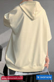 Beige hoodie held by a person on a gray background with 'tomscloth.com' branding.