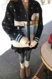 Person wearing a patterned cardigan with a blurred background