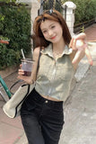 Woman holding a drink and making a peace sign on a sidewalk