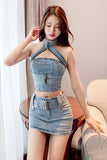Woman wearing a denim outfit sitting on a couch.