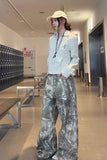 Person wearing a light shirt and camouflage pants in a locker room.