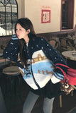 Woman wearing a patterned sweater in an indoor setting
