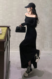 Woman in a black dress and cap holding a black handbag against a neutral background