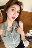 Woman with a tattoo on her neck sitting in a cafe.
