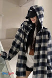 Person wearing a plaid hooded coat with a plain background